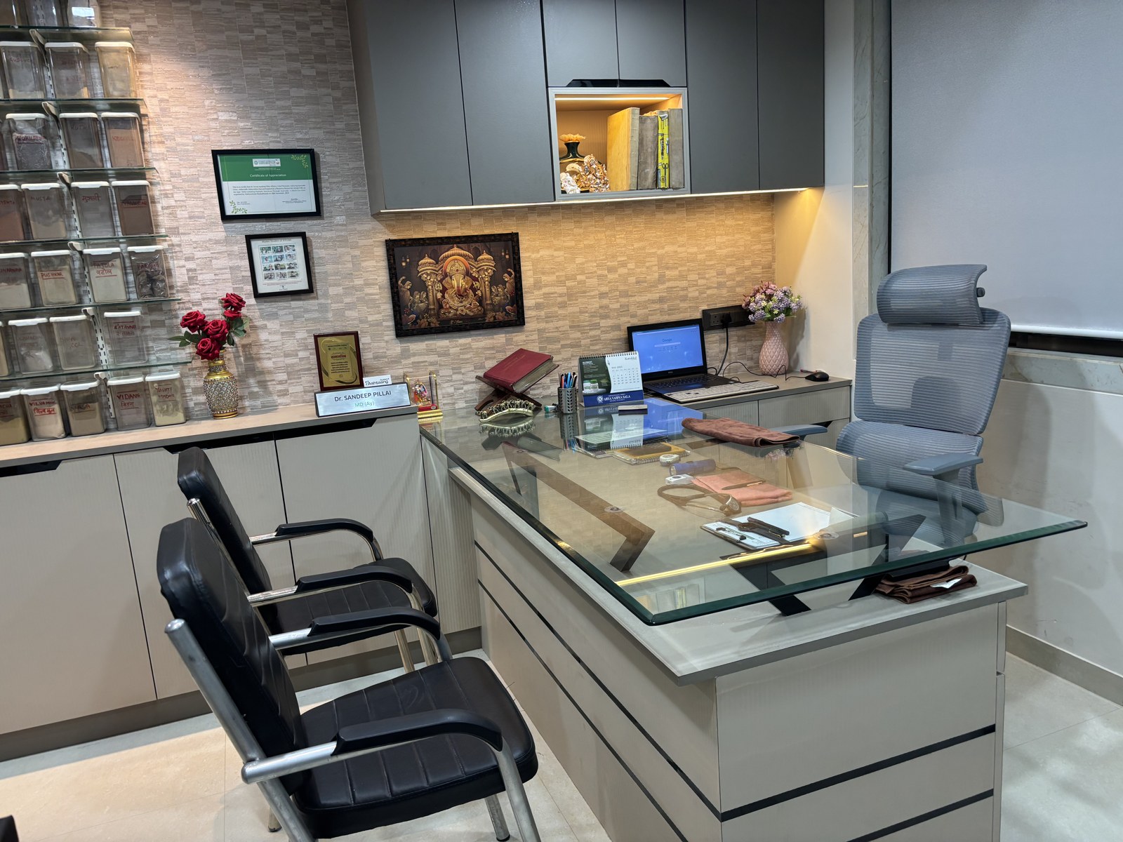 Consultation desk and visitor chairs at Ashtaang