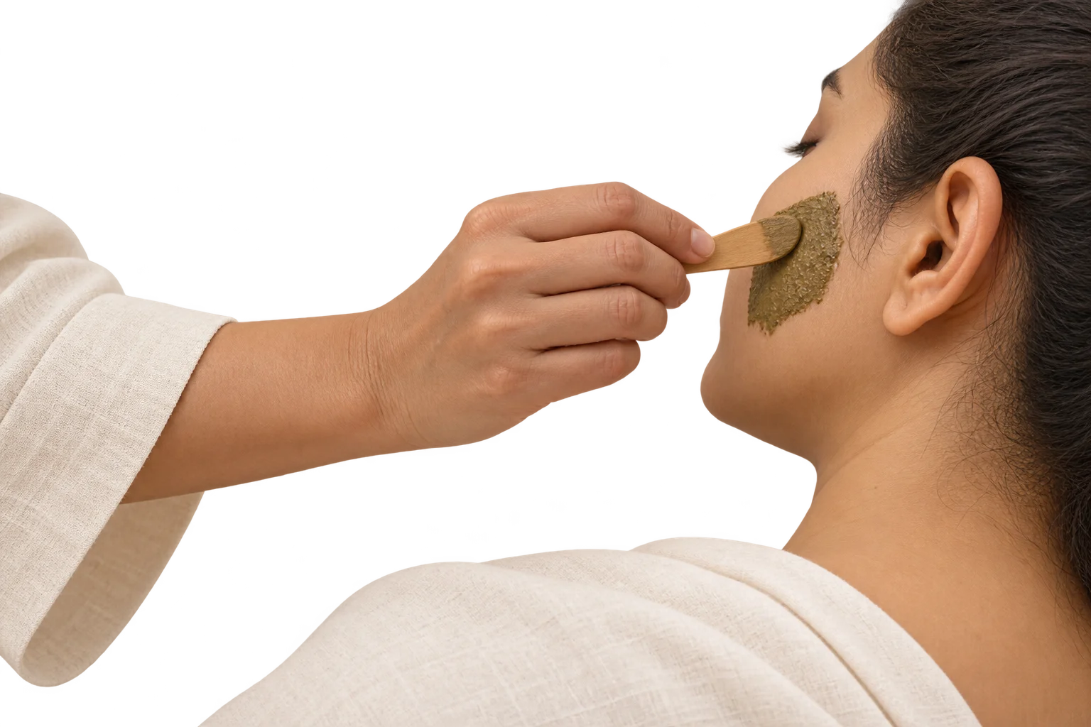 Illustration of a selected herbal paste being applied to a cheek.